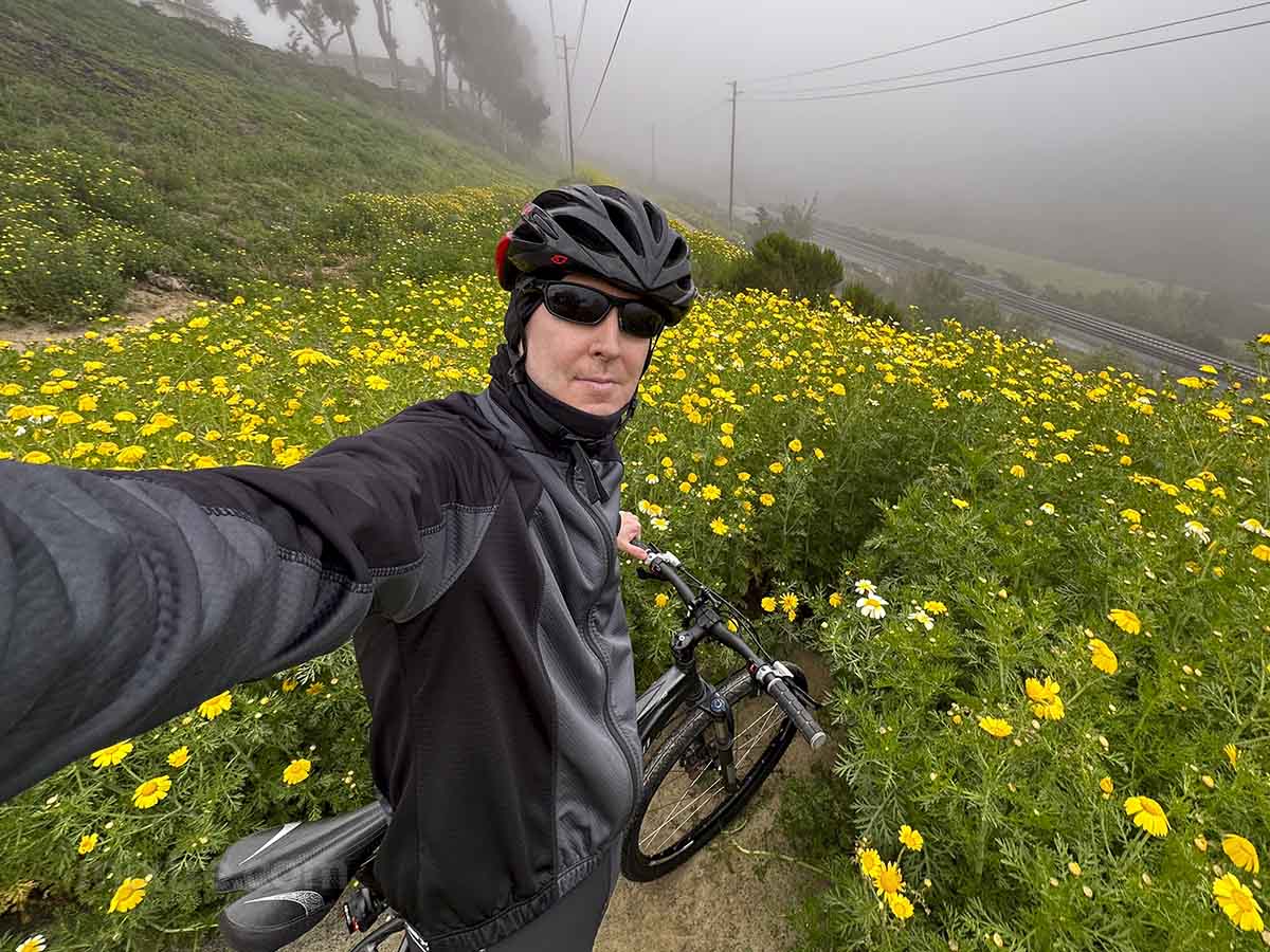 Riding my mountain bike on a trail with blooming flowers